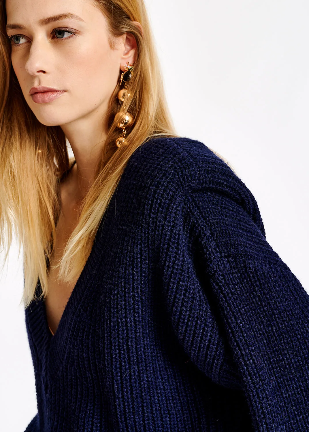 Dark blue sweater with padded shoulders