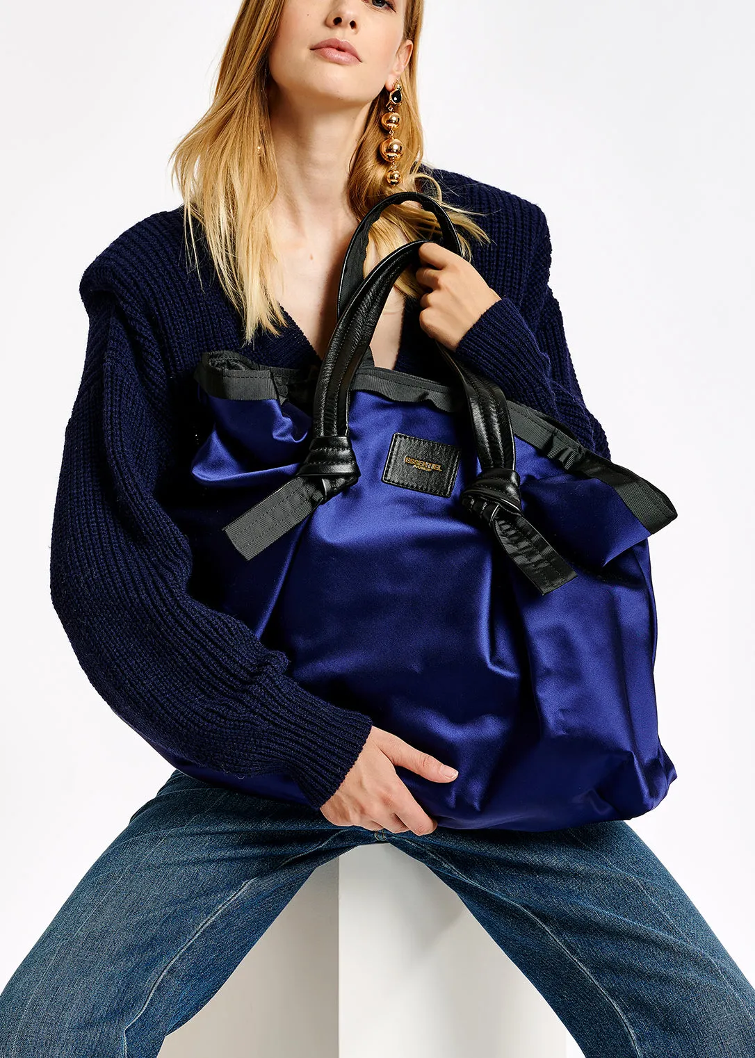 Dark blue sweater with padded shoulders