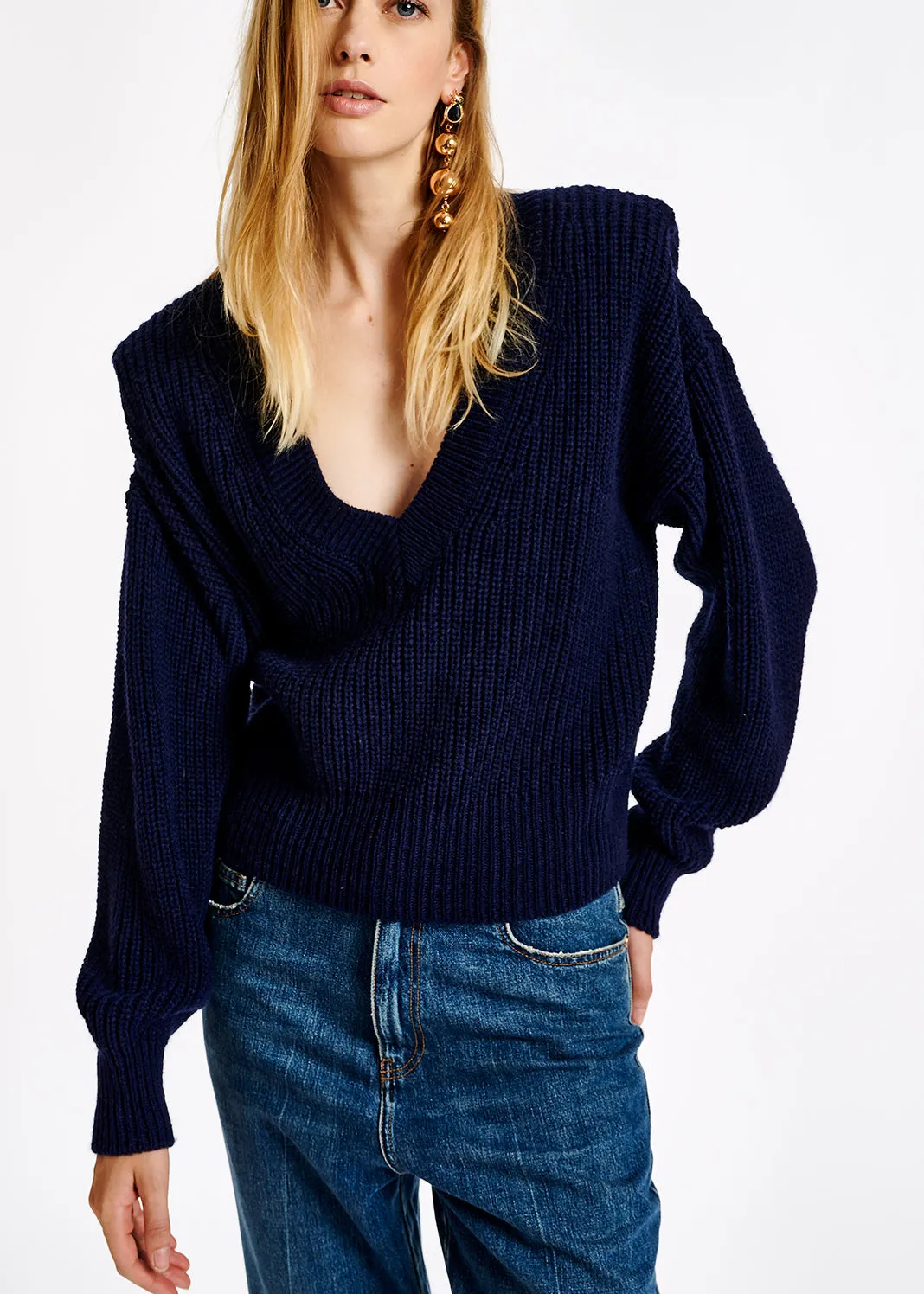 Dark blue sweater with padded shoulders