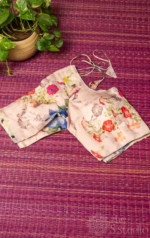 Light pink semi-silk readymade blouse with floral prints.