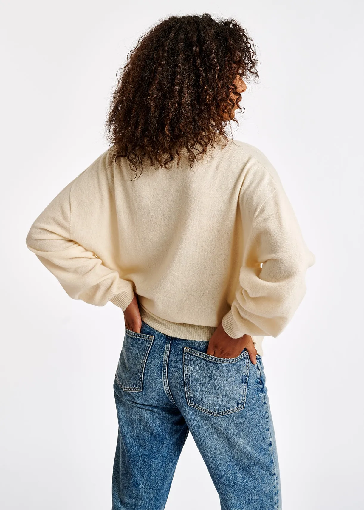 Off-white merino wool blend turtleneck sweater