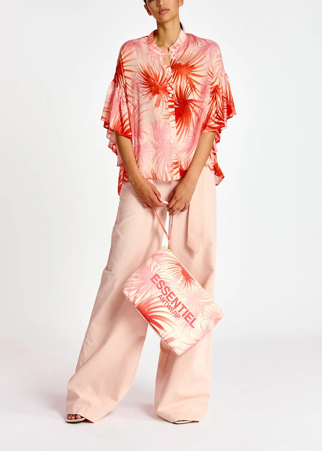 Orange ruffle-detailed top with palm leaf print