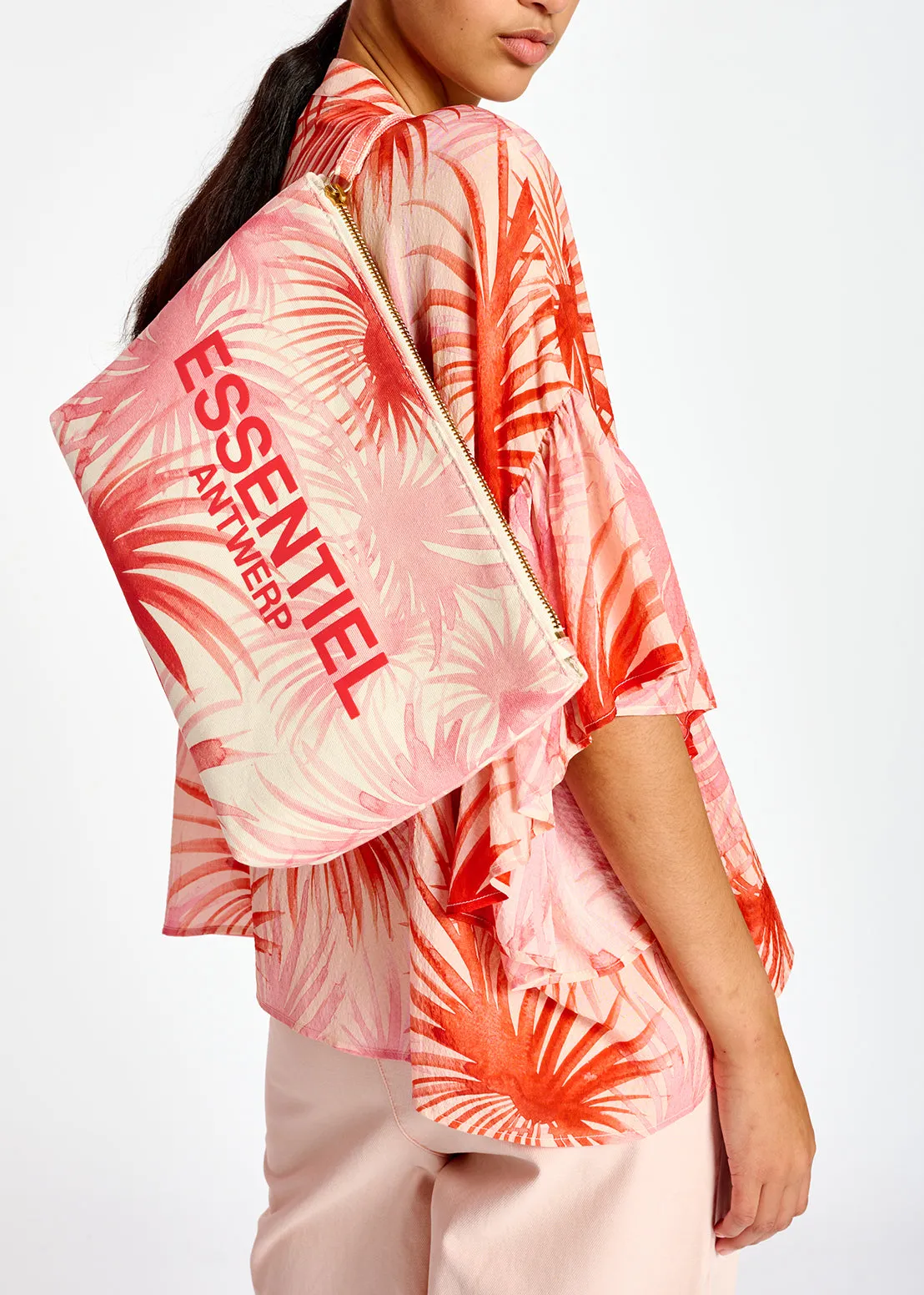 Orange ruffle-detailed top with palm leaf print
