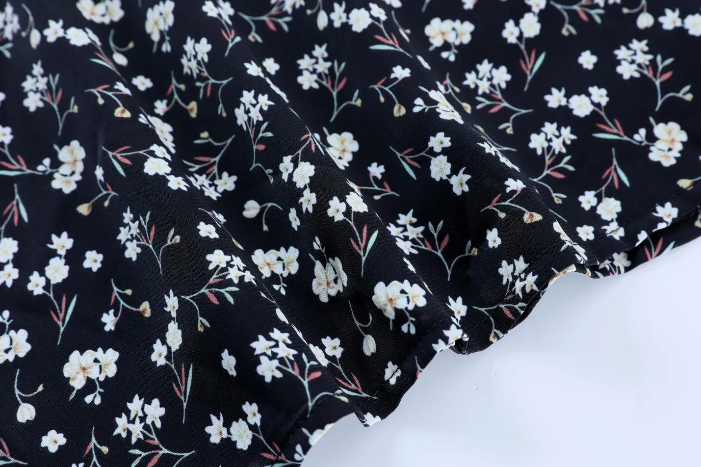 Stunning V-Neck Black Tea Tea Dress with Floral Design